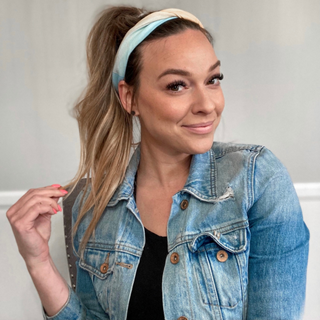 woman with wavy hair red headband